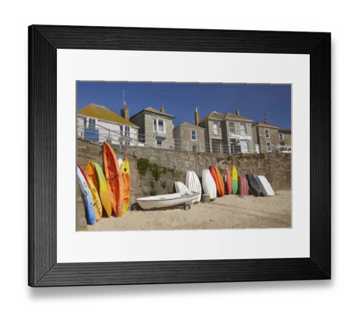 Framed Print : Kayaks and dinghies stacked against seawall at Mousehole, near Penzance, Cornwall Framed Print : Kayaks and dinghies stacked against seawall at Mousehole, near Penzance, Cornwall