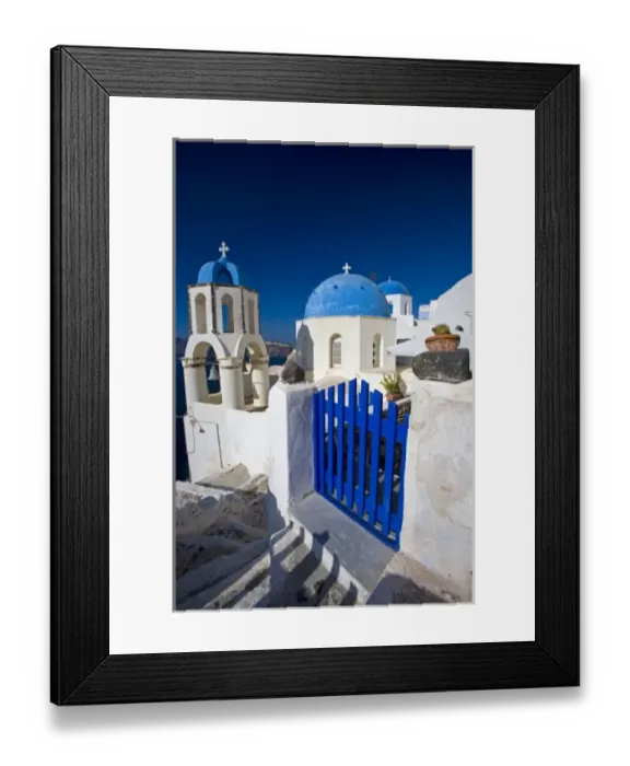 Framed Print : Greece and Greek Island of Santorini town of Oia with Blue Domed Churches with white
