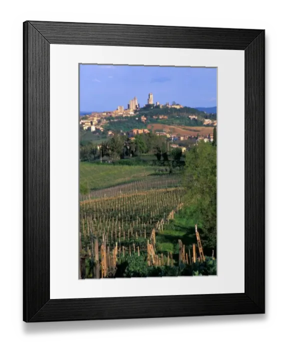Framed Print : The village of San Gimignano sits in the rolling hills of Tuscany, Italy Framed Print : The village of San Gimignano sits in the rolling hills of Tuscany, Italy