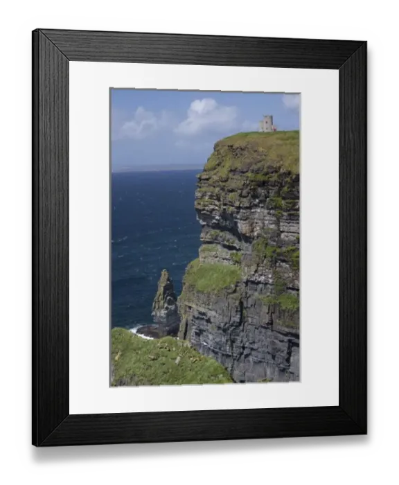 Framed Print : Scenic Cliffs of Moher and O Briens Tower under a blue sky and white puffy Framed Print : Scenic Cliffs of Moher and O Briens Tower under a blue sky and white puffy