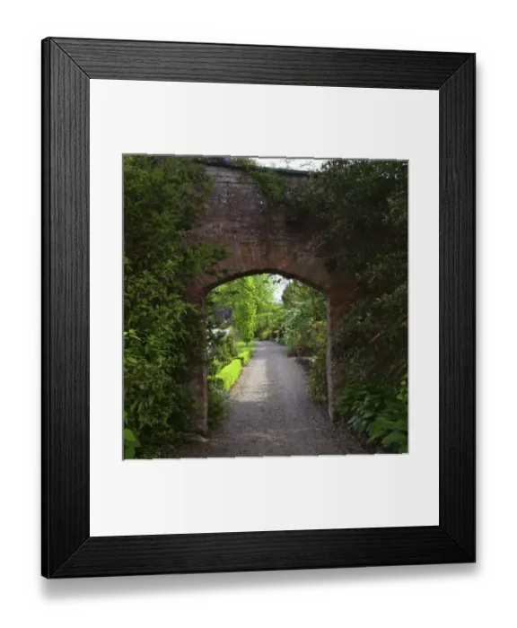 Framed Print : Ireland, the Dromoland Castle very green walled garden path through a brick archway Framed Print : Ireland, the Dromoland Castle very green walled garden path through a brick archway