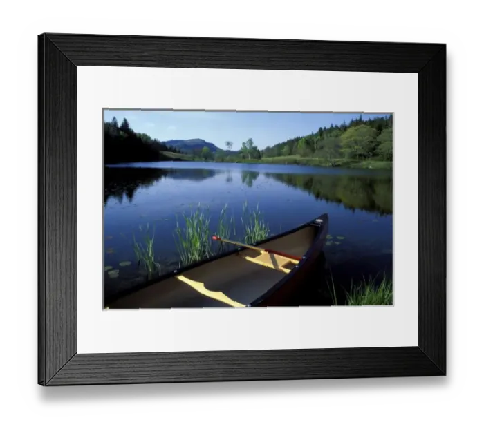 Framed Print : A canoe rests on the shore of Little Long Pond at Acadia National Park, Maine