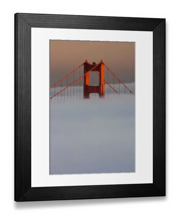 Framed Print : Fog rolls through the San Francisco bay covering the Golden Gate Bridge. Pictured