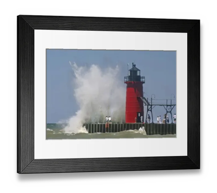 Framed Print : People on jetty watch large breaking waves in South Haven Michigan