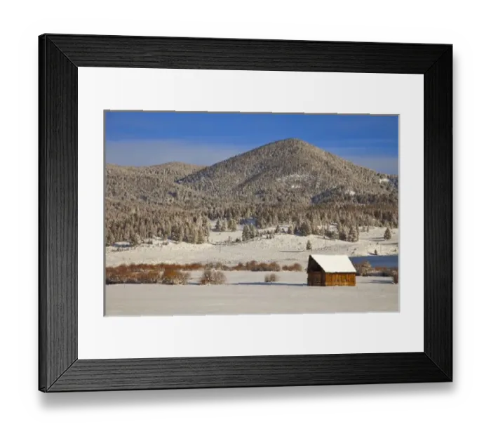 Framed Print : Wooden barn sits in snow near the Boulder River near Basin, Montana