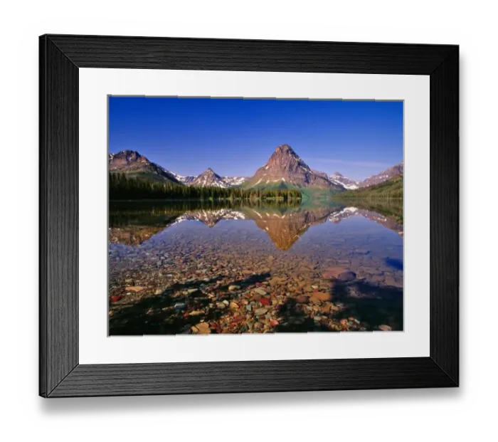 Framed Print : Mountains reflect into calm Two Medicine Lake in Glacier National Park in Montana Framed Print : Mountains reflect into calm Two Medicine Lake in Glacier National Park in Montana