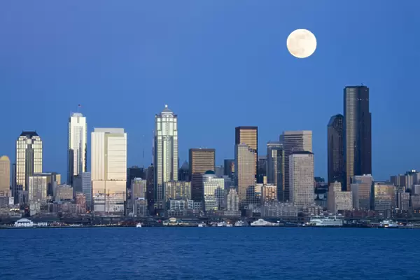WA, Seattle, Seattle skyline and Elliott Bay with full moon rising, view from Alki