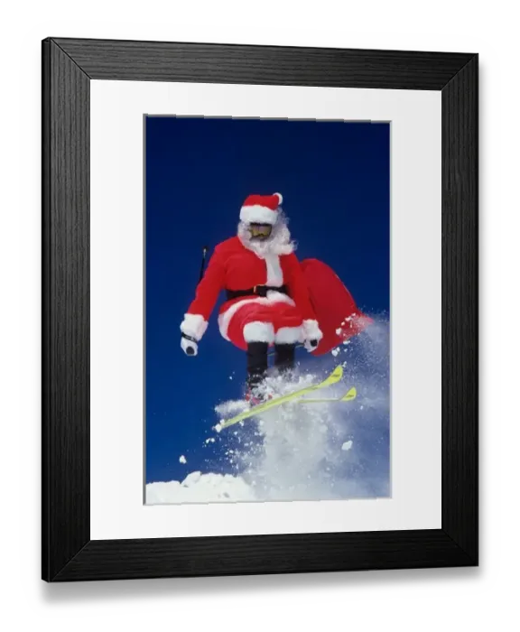 Framed Print : Santa Claus on skis jumping off a cornice at Snowbird, Utah Framed Print : Santa Claus on skis jumping off a cornice at Snowbird, Utah