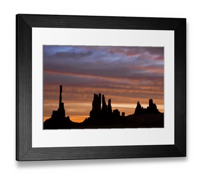Framed Print : USA, Utah, Monument Valley National Park. Sunrise creates silhouettes of totem pole-like
