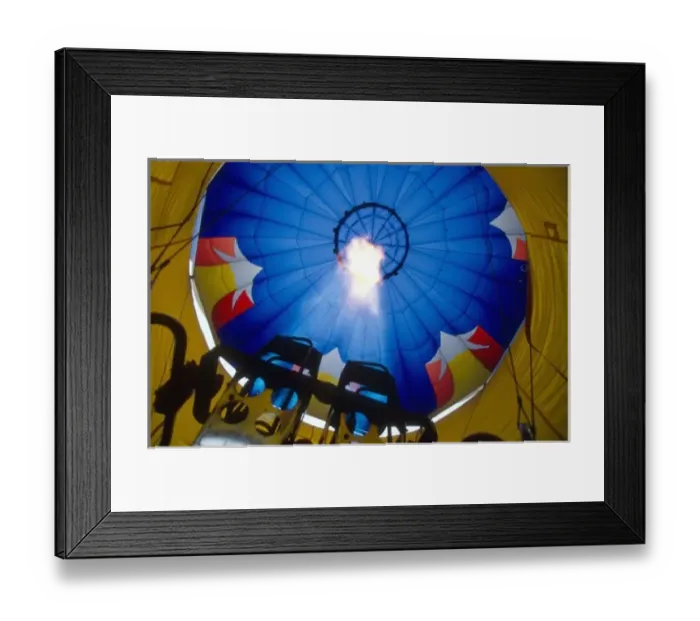Framed Print : A burner inflates the envelope of a hot air balloon