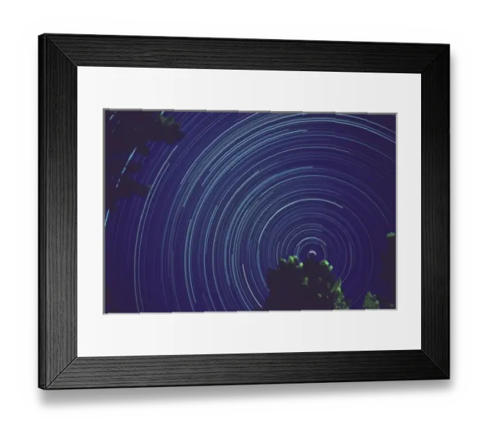 Framed Print : Time exposure centered on North Star night star tracks from earths rotation Framed Print : Time exposure centered on North Star night star tracks from earths rotation