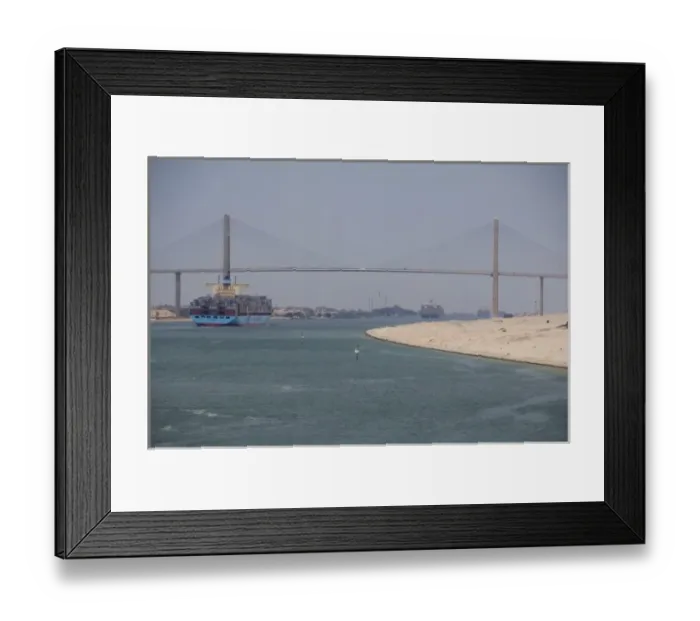 Framed Print : Egypt, Suez Canal. Cargo ship passing under Bridge of Peace (aka Peace Bridge) Framed Print : Egypt, Suez Canal. Cargo ship passing under Bridge of Peace (aka Peace Bridge)