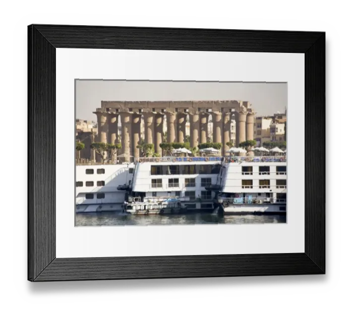 Framed Print : Egypt, Luxor. Nile cruise boats docked side by side and the gigantic columns of Luxor Framed Print : Egypt, Luxor. Nile cruise boats docked side by side and the gigantic columns of Luxor