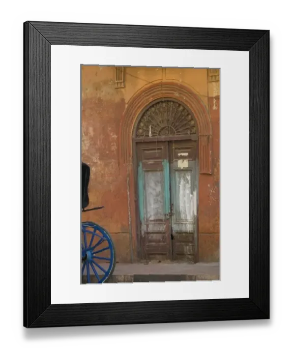 Framed Print : Horse Drawn Cart parked along the market in Luxor with an old doorway as backdrop, Egypt Framed Print : Horse Drawn Cart parked along the market in Luxor with an old doorway as backdrop, Egypt