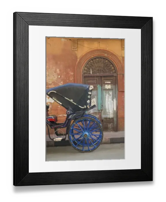Framed Print : Horse Drawn Cart parked along the market in Luxor with an old doorway as backdrop, Egypt Framed Print : Horse Drawn Cart parked along the market in Luxor with an old doorway as backdrop, Egypt