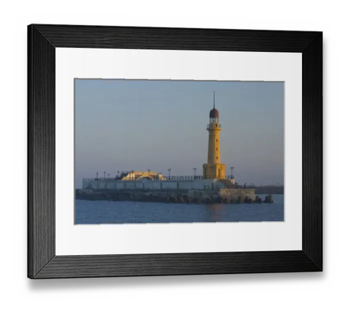 Framed Print : Lighthouse along the Jetty in Alexandria with a small harbor along the Mediterranean Sea, Egypt Framed Print : Lighthouse along the Jetty in Alexandria with a small harbor along the Mediterranean Sea, Egypt