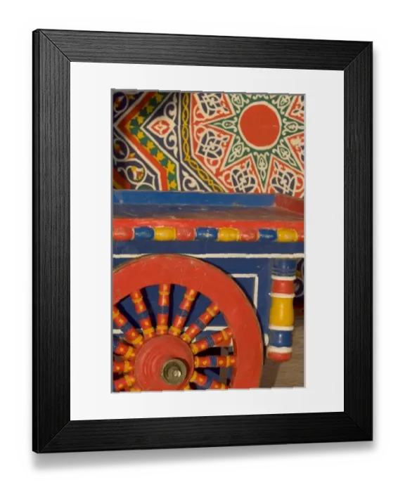 Framed Print : Vendors cart and wheel design of the colorful wooden spokes in Alexandria, Egypt Framed Print : Vendors cart and wheel design of the colorful wooden spokes in Alexandria, Egypt