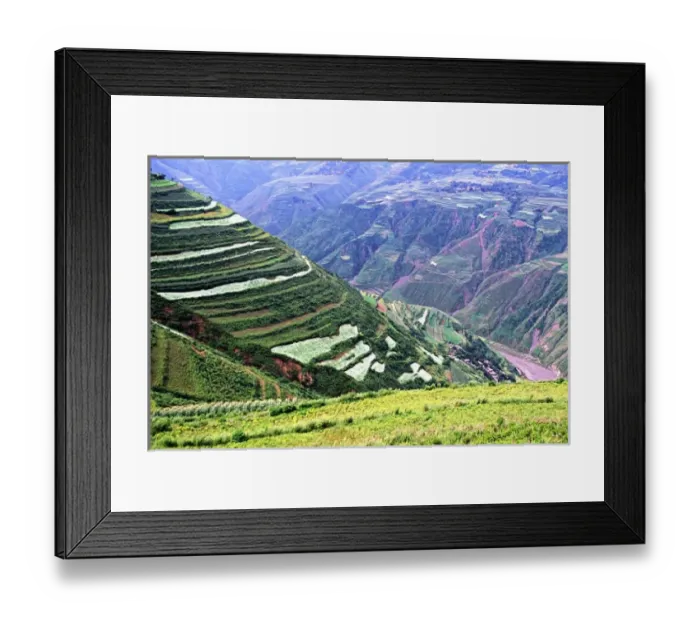 Framed Print : Asia, China, Yunnan, Dongchuan. Green crops cover terraces in canyons of red earth