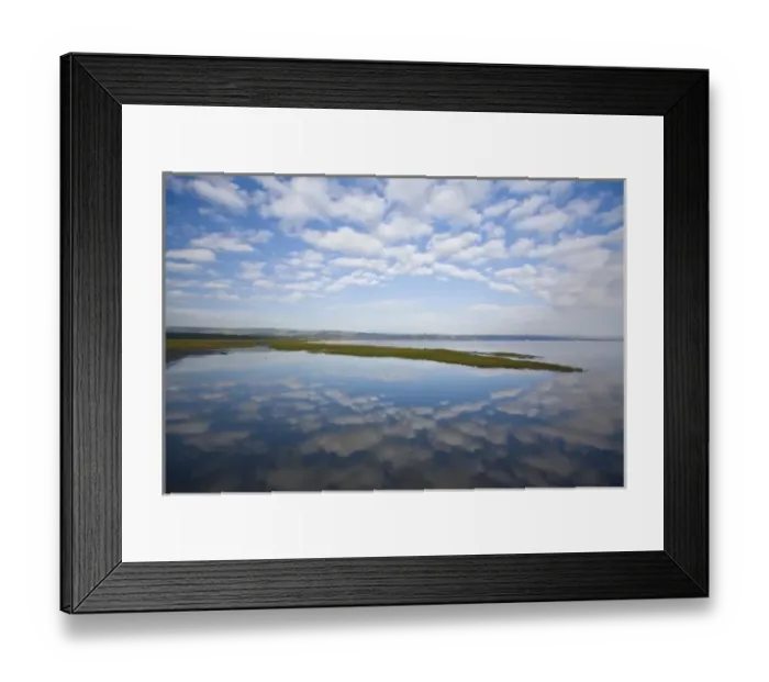 Framed Print : View of sky and clouds reflected in the waters of Lake Nakuru, Kenya as lesser flamingoes Framed Print : View of sky and clouds reflected in the waters of Lake Nakuru, Kenya as lesser flamingoes