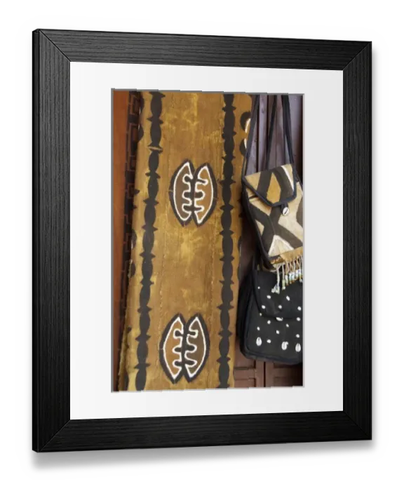 Framed Print : Africa, Gambia. Capital city of Banjul. Typical hand painted African fabric & small