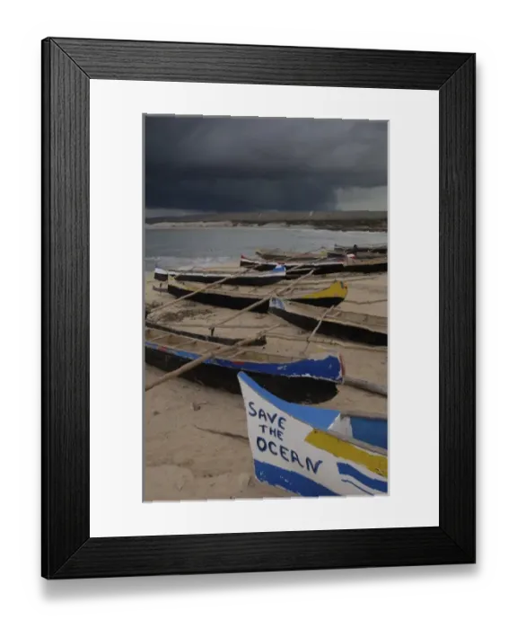 Framed Print : Piroque or outrigger canoe back from fishing and left up on the beach for the night