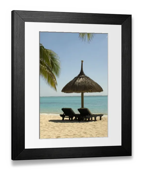 Framed Print : Mauritius. Idyllic beach scene with umbrella, chairs and palm fronds Framed Print : Mauritius. Idyllic beach scene with umbrella, chairs and palm fronds