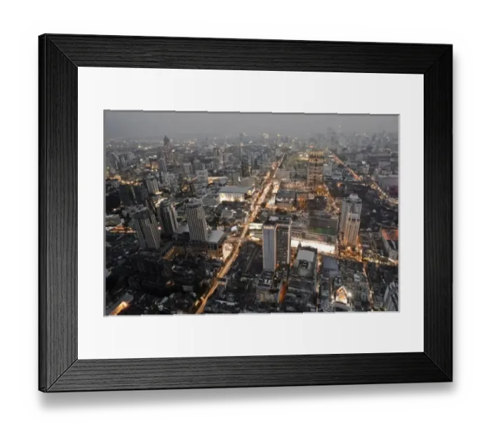 Framed Print : Bangkok, Thailand - The downtown district of a city at dusk with smog in the background Framed Print : Bangkok, Thailand - The downtown district of a city at dusk with smog in the background