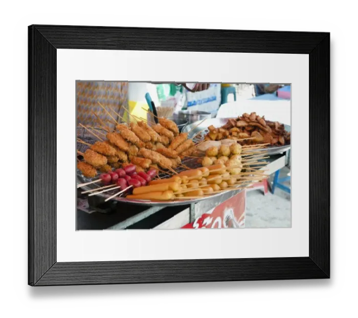 Framed Print : Bangkok, Thailand - Selection of delicious looking fried foods for sale at a street