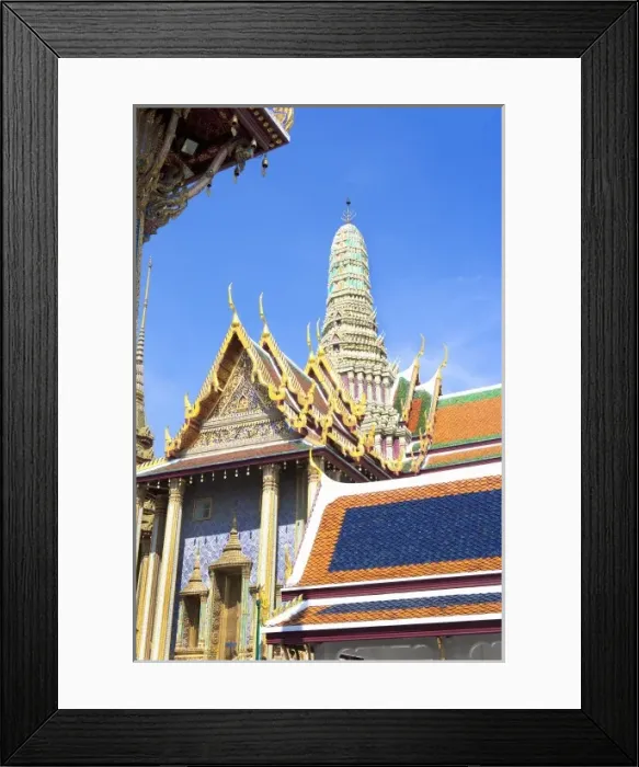 Framed Print : Bangkok, Thailand - The entrance to a Buddhist temple showing a high roof and colorful tiles
