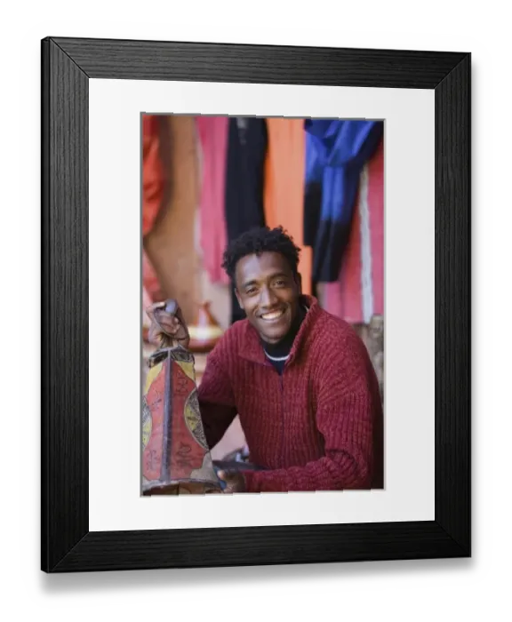 Framed Print : MOROCCO, South of the High Atlas, OUARZAZATE: Young Lamp Seller / Ensemble Artisanat (MR) Framed Print : MOROCCO, South of the High Atlas, OUARZAZATE: Young Lamp Seller / Ensemble Artisanat (MR)