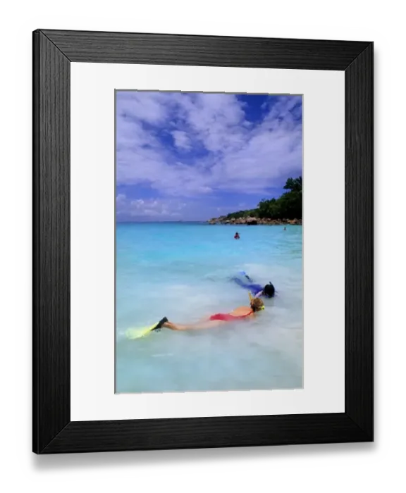 Framed Print : Snorklers in the water at the beautiful perfect scene of the famous waters at La Framed Print : Snorklers in the water at the beautiful perfect scene of the famous waters at La