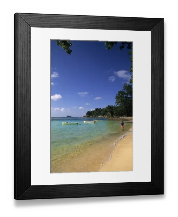 Framed Print : Woman relaxing alone in the beautiful beach in the beautiful village of La Digue Framed Print : Woman relaxing alone in the beautiful beach in the beautiful village of La Digue