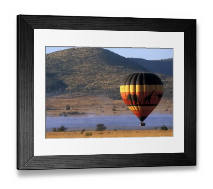 Framed Print : South Africa, Pilanesburg Game Reserve, Hot air balloon rises above mist-covered