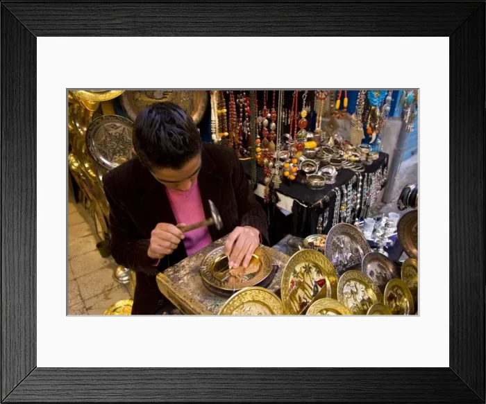 Framed Print : Man pounding metal plates in streets of the Medina area of Tunis Tunisia of Northern Framed Print : Man pounding metal plates in streets of the Medina area of Tunis Tunisia of Northern