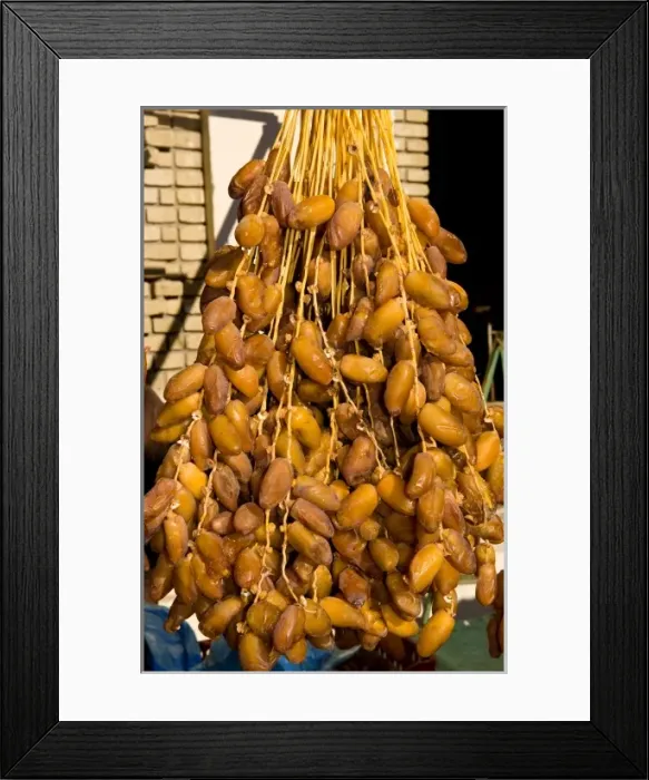 Framed Print : Dates hanging on street scene of Tozeur on the edge of the Sahara Deseret in Tunisia Framed Print : Dates hanging on street scene of Tozeur on the edge of the Sahara Deseret in Tunisia