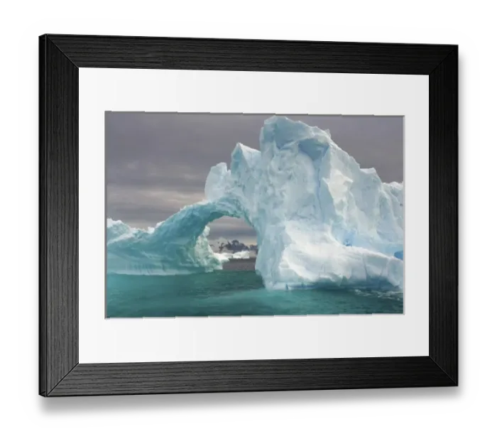 Framed Print : arched iceberg floating off the western Antarctic peninsula, Antarctica, Southern Ocean