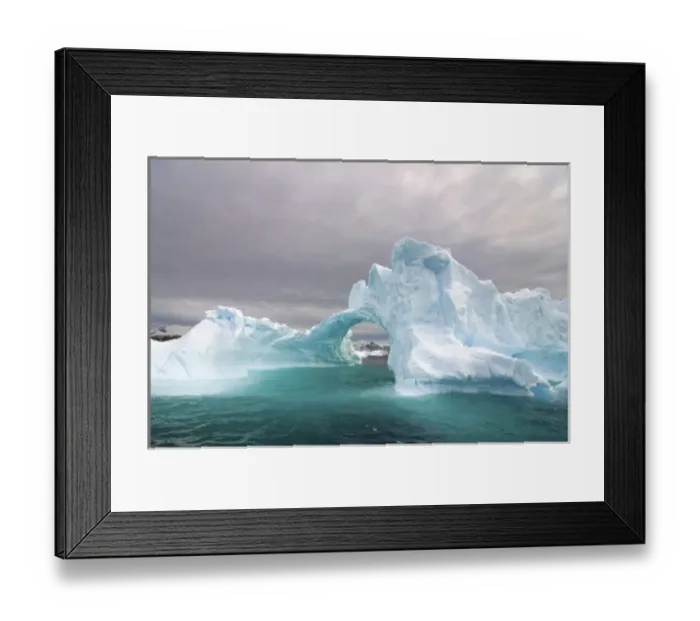 Framed Print : arched iceberg floating off the western Antarctic peninsula, Antarctica, Southern Ocean Framed Print : arched iceberg floating off the western Antarctic peninsula, Antarctica, Southern Ocean