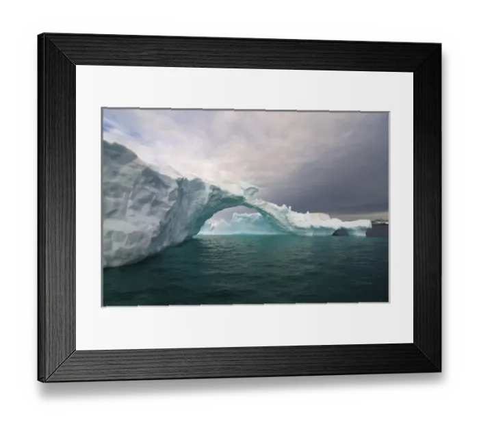 Framed Print : arched iceberg floating off the western Antarctic peninsula, Antarctica, Southern Ocean Framed Print : arched iceberg floating off the western Antarctic peninsula, Antarctica, Southern Ocean