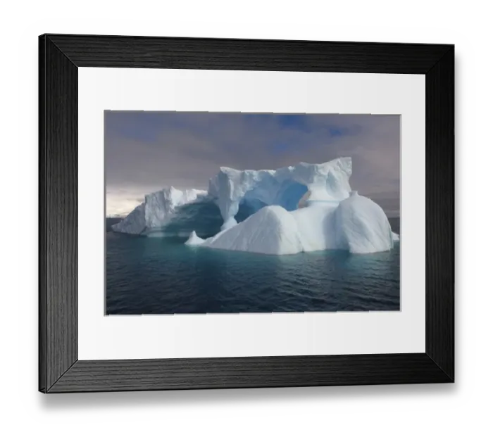Framed Print : arched iceberg floating off the western Antarctic peninsula, Antarctica, Southern Ocean Framed Print : arched iceberg floating off the western Antarctic peninsula, Antarctica, Southern Ocean