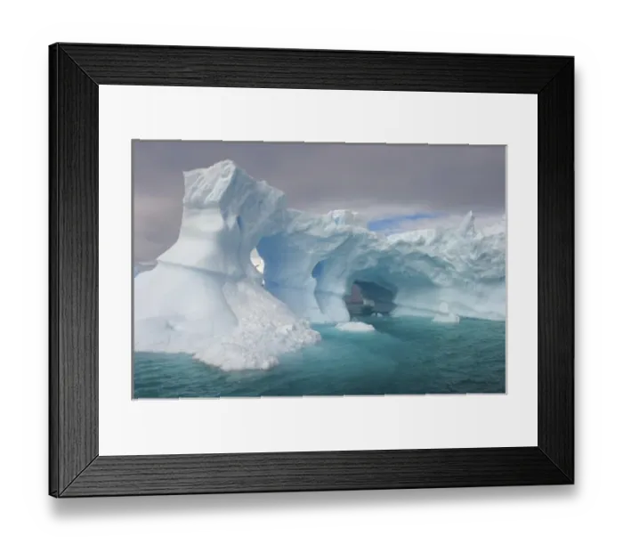 Framed Print : arched iceberg floating off the western Antarctic peninsula, Antarctica, Southern Ocean Framed Print : arched iceberg floating off the western Antarctic peninsula, Antarctica, Southern Ocean
