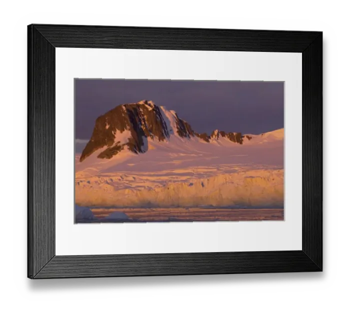 Framed Print : frozen glacial mountain landscape along the western Antarctic peninsula at sunset