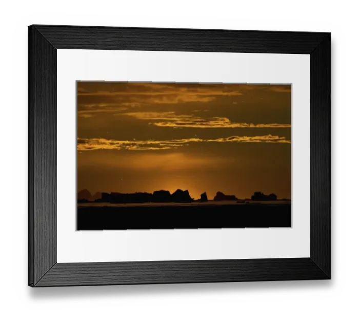 Framed Print : icebergs silhouetted at sunset, off the western Antarctic peninsula, Antarctica