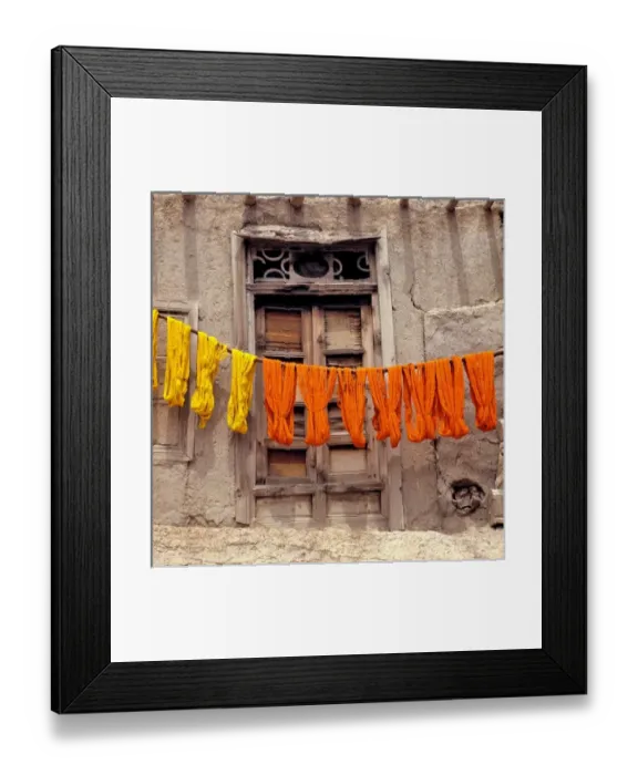 Framed Print : Afghanistan, Ghazni. Colorful woolen yarn dries on wooden poles in Ghazni in Afghanistan