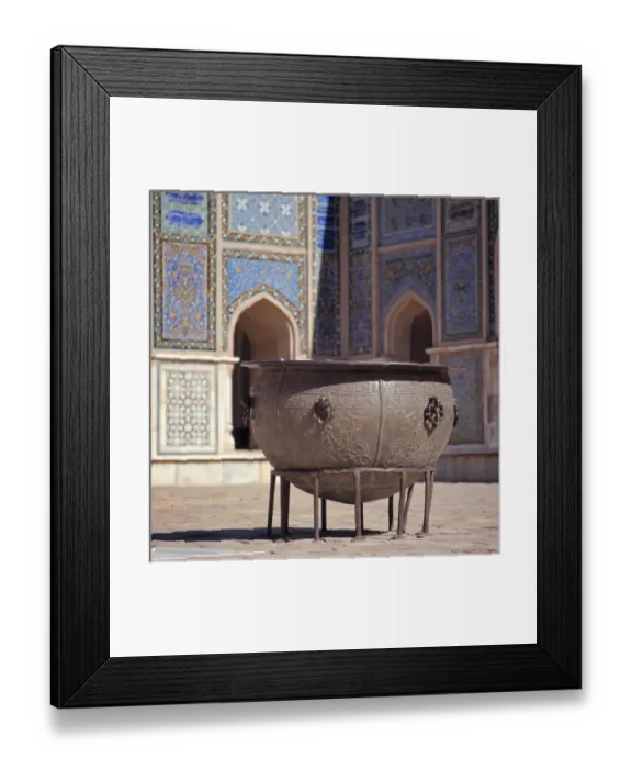 Framed Print : Afghanistan, Herat. An ancient brass cauldron rests in the inner courtyard