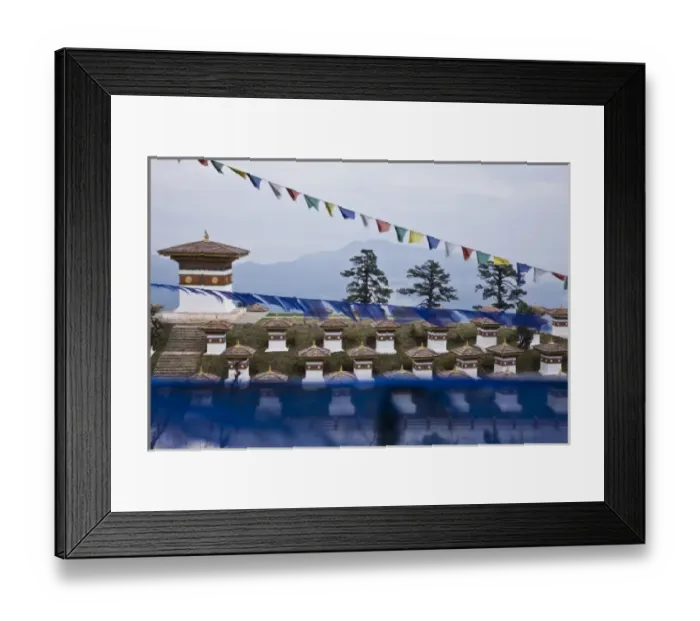 Framed Print : Bhutan, Dochu La. Prayer flags float above 108 stupas at Dochu La pass Framed Print : Bhutan, Dochu La. Prayer flags float above 108 stupas at Dochu La pass