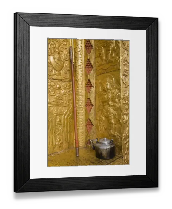 Framed Print : Bhutan, Punakha Dzong. Old tea pot and staff outside the gilded temple walls Framed Print : Bhutan, Punakha Dzong. Old tea pot and staff outside the gilded temple walls