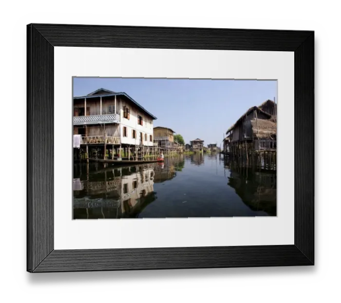 Framed Print : Asia, Myanmar, Inle Lake, canoe paddling through Intha stilt village in dry season Framed Print : Asia, Myanmar, Inle Lake, canoe paddling through Intha stilt village in dry season