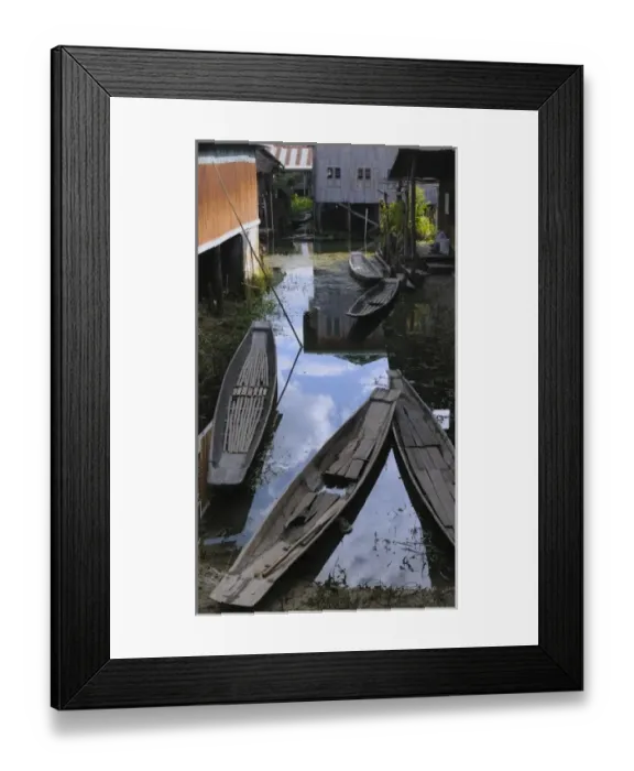 Framed Print : Asia, Myanmar (Burma), Lake Inle. Canoes parked between houses at Lake Inle Framed Print : Asia, Myanmar (Burma), Lake Inle. Canoes parked between houses at Lake Inle