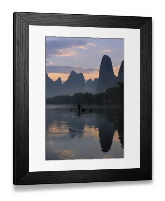 Framed Print : Traditional fisherman with his cormorants on the Li River at sunrise, Guilin, China Framed Print : Traditional fisherman with his cormorants on the Li River at sunrise, Guilin, China