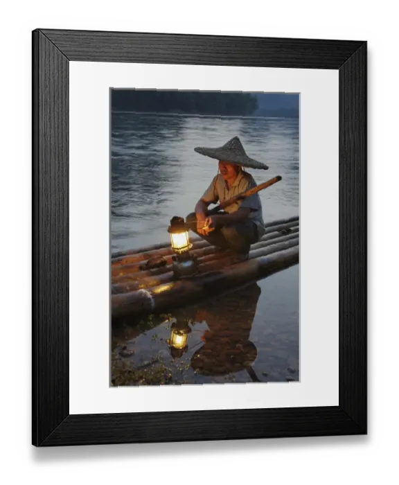 Framed Print : Traditional fisherman with lantern at sunset, Li River, near Guilin, China Framed Print : Traditional fisherman with lantern at sunset, Li River, near Guilin, China